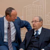 Doug DeVos sitting next to Richard DeVos.